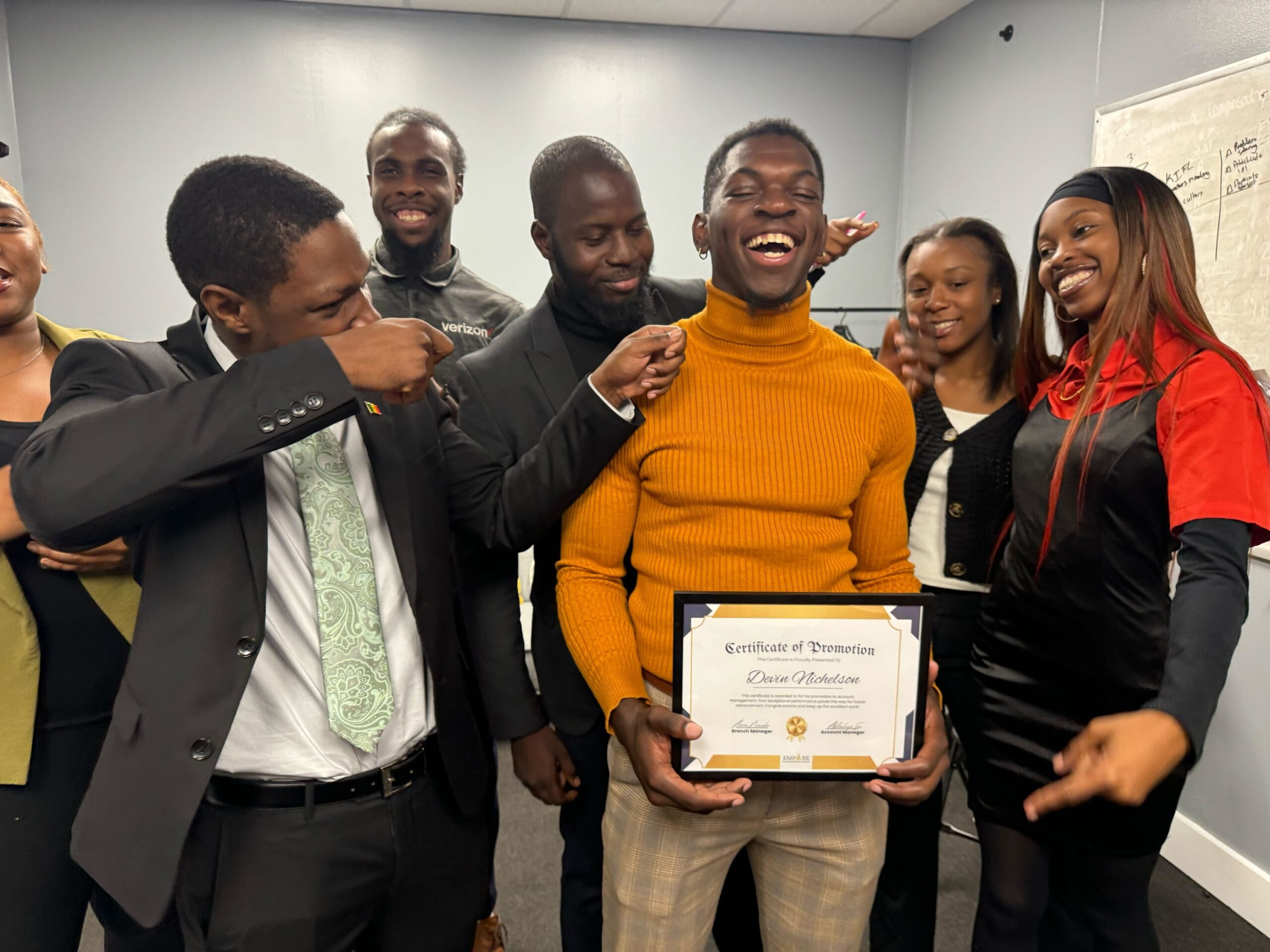 Employees collaborating in a professional workplace that encourages teamwork and career advancement.