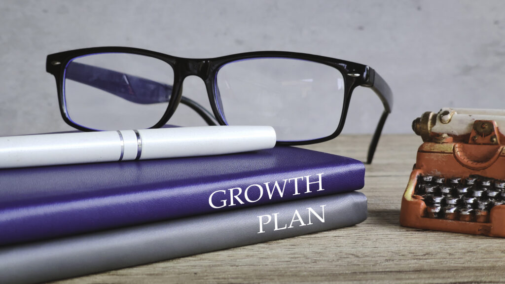 A professional growth plan with a pair of eyeglasses